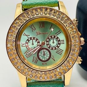 Geneva Quartz Analog Watch Rhinestone and Gold Case. Mint Green Band. 9 inches